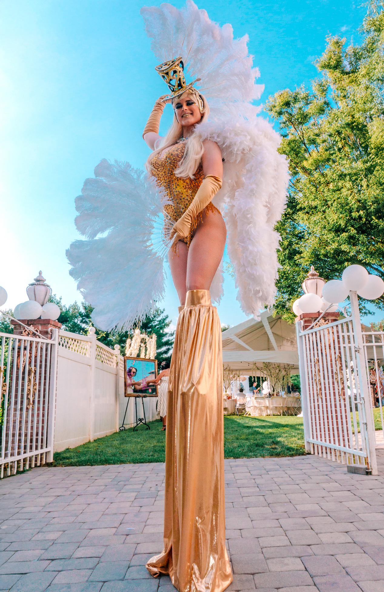 Gatsby stilt walker greeting guests at a private event